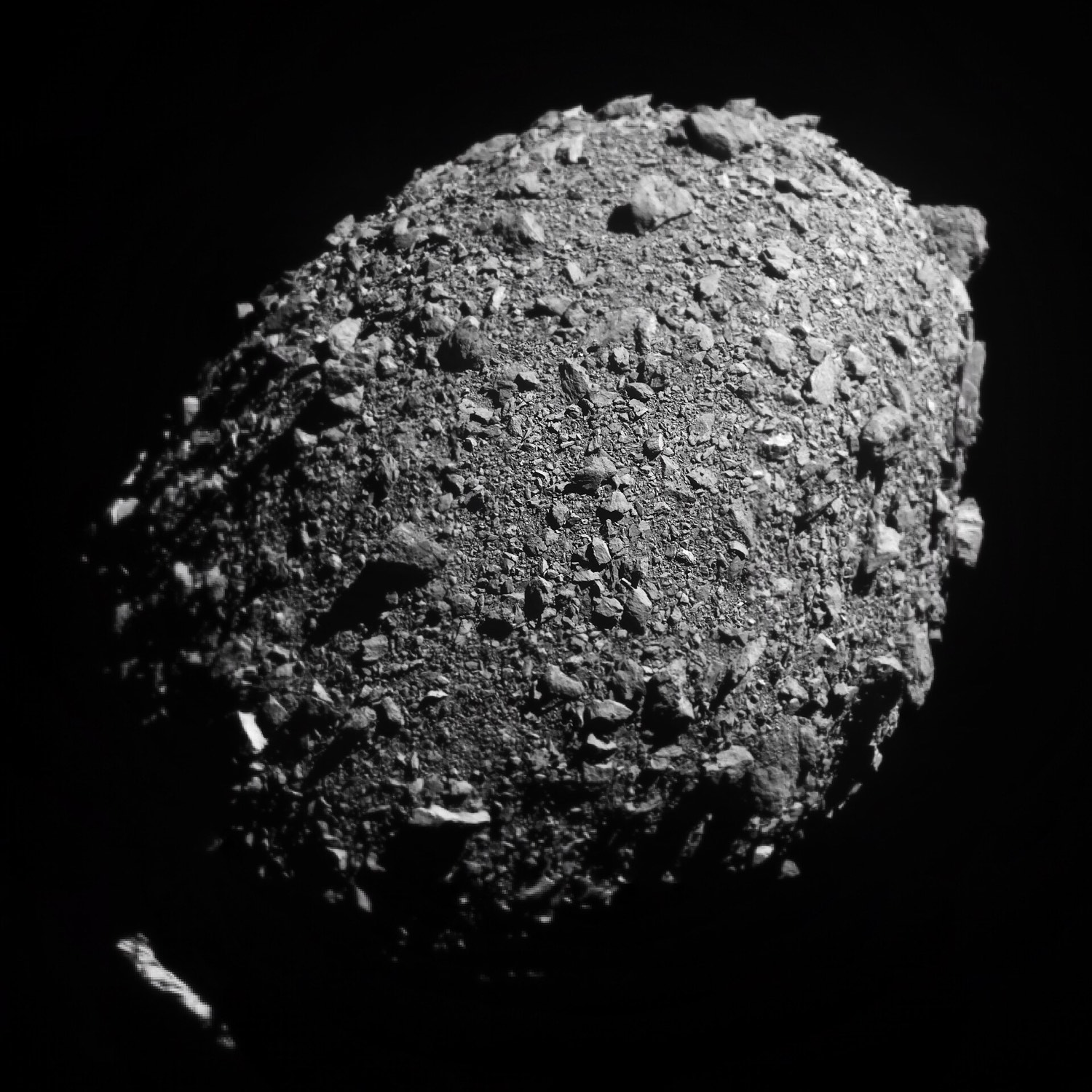Grey, boulder-strewn surface of the small asteroid Dimorphos, seen in the last images before DART's impact